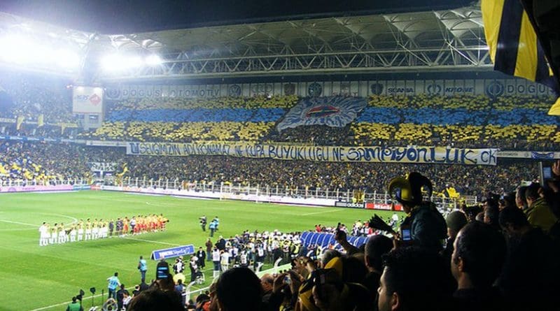 Soccer fans supporting Turkey's Fenerbahçe S.K. Photo by Kızıl Şaman, Wikipedia Commons.