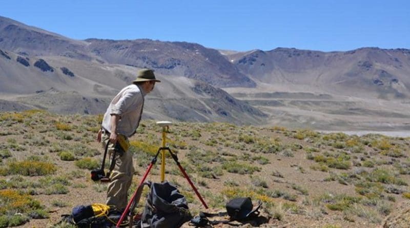 Basil Tikoff, professor of geoscience at UW-Madison, uses a precise GPS instrument to record shoreline altitude at Laguna del Maule. Credit Brad Singer, University of Wisconsin-Madison