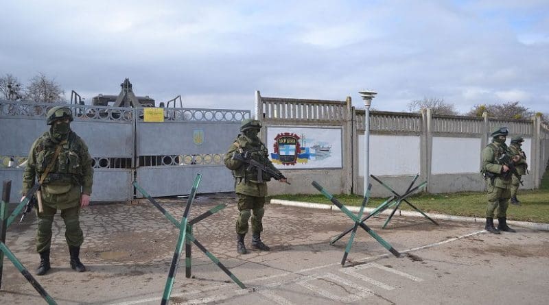 Russia's "Little green men" armed with AK-74Ms blockading Perevalne military base, 25 kilometres south of Simferopol, 9 March 2014. Photo by Anton Holoborodko, Wikipedia Commons.