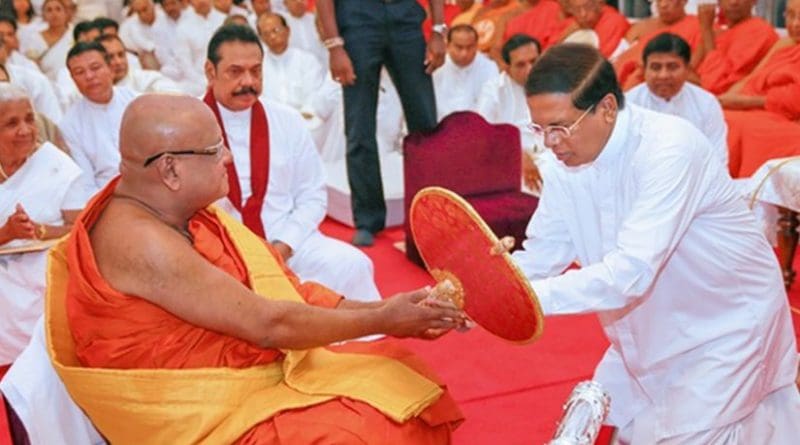 Sri Lanka's President Maithripala Sirisena participates in ceremony to offer Sannas Pathraya to new Anu Nayaka Thero. Photo Credit: Sri Lanka government.