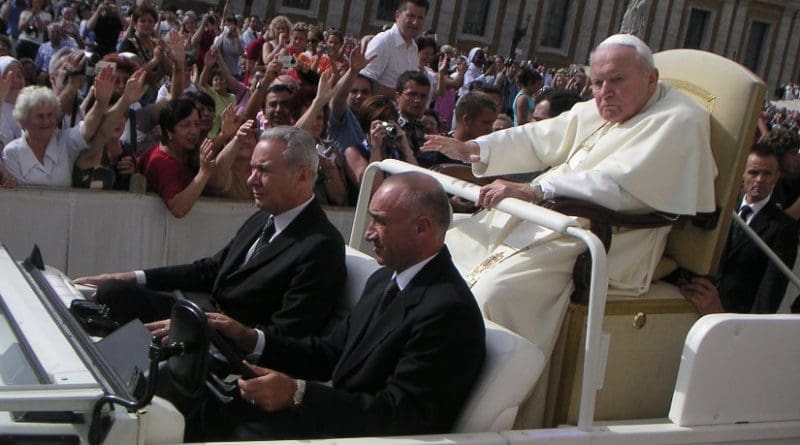 An ailing John Paul II riding in the Popemobile. Source: Wikipedia Commons.