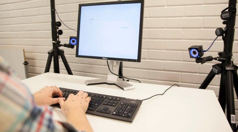 High-speed cameras track the exact position of the hands and fingers while typing. Eye-tracking glasses reveal the eye movements between the screen and keyboard. Photo: Aalto University, Mikko Raskinen
