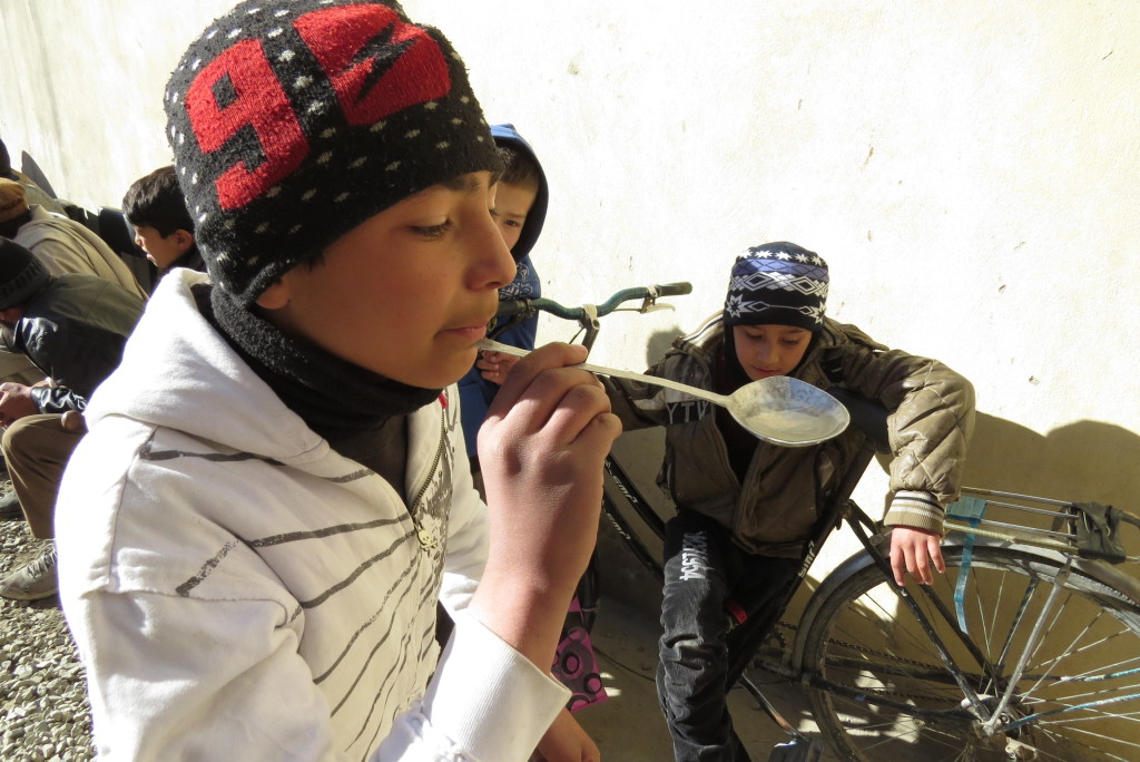 Zuhair playing a game on the importance of saving water at the Borderfree Street Kids School. Photo by Dr. Hakim.