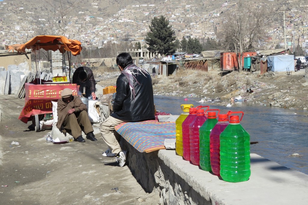 Zuhair’s mother was sitting on the ledge in a blue burqa. Houses can be seen on the hill. Photo by Dr. Hakim.