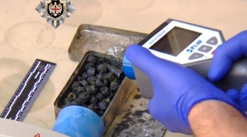 Screengrab from a video footage distributed on April 28, 2016 by the Georgian State Security Service showing investigators checking the radioactivity level of what the security service said was seized 1.6kg of uranium.