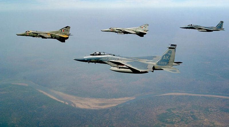 USAF F-15C Eagles from Elmendorf AFB, Alaska and Indian air force MIG-27 Floggers fly together over the Indian landscape.IAF courtesy photo, Wikipedia Commons.