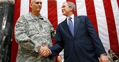 US President George W. Bush stands on stage with U.S. Army Gen. Ray Odierno, commander, Mulitnational Force Iraq, after Bush addressed U.S. military and diplomatic personnel at Al Faw Palace on Camp Victory in Baghdad, Dec. 14, 2008. White House photo by Eric Draper