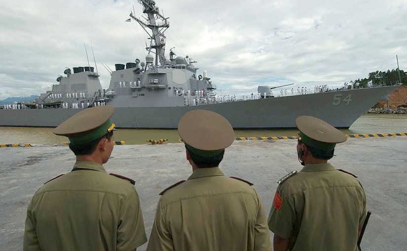 Vietnamese military officials watch as USS Curtis Wilbur (DDG 54) prepares to moor in the Vietnamese port of Da Nang. U.S. Navy photo by Photographer’s Mate 2nd Timothy Smith