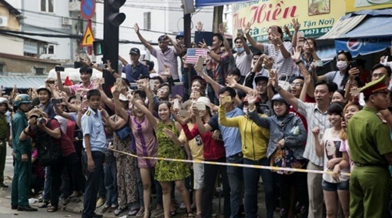 People wave from along the street as President Barack Obama passed by in a motorcade after arriving in Ho Chi Minh City, Vietnam, May 24, 2016. (Official White House Photo by Pete Souza)