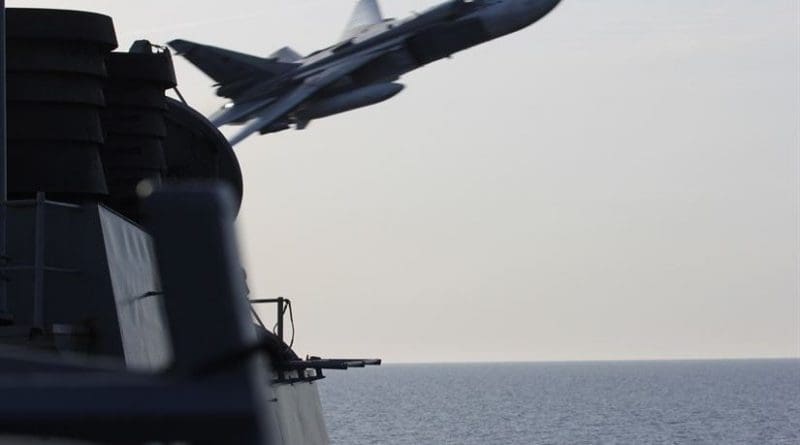 A Russian Sukhoi Su-24 attack aircraft makes a very low-altitude pass by the guided-missile destroyer USS Donald Cook in international waters in the Baltic Sea, April 12, 2016. The USS Donald Cook, forward-deployed to Rota, Spain, is conducting a routine patrol in the U.S. 6th Fleet area of operations in support of U.S. national security interests in Europe. Navy photo