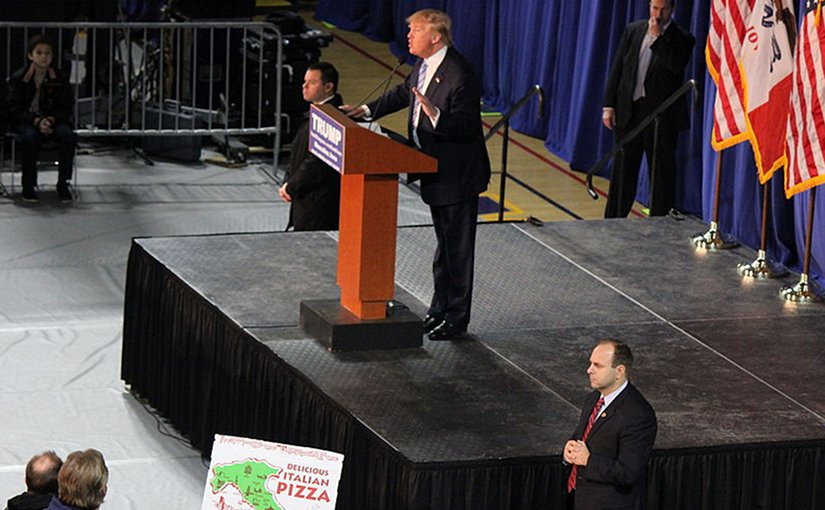 Donald Trump with two United States Secret Service agents beside him. Photo by Evan Guest, Wikipedia Commons.