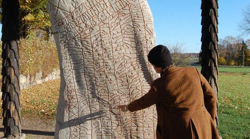 This is Per Holmberg, researcher at University of Gothenburg with the Rök Runestone. Credit University of Gothenburg