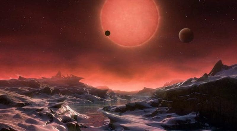This artist's impression shows an imagined view from the surface one of the three planets orbiting an ultracool dwarf star just 40 light-years from Earth that were discovered using the TRAPPIST telescope at ESO's La Silla Observatory. These worlds have sizes and temperatures similar to those of Venus and Earth and are the best targets found so far for the search for life outside the solar system. They are the first planets ever discovered around such a tiny and dim star. In this view one of the inner planets is seen in transit across the disc of its tiny and dim parent star. Credit ESO/M. Kornmesser