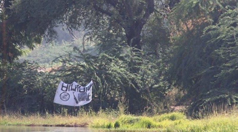 A Boko Haram flag flying near the Bosso post on the Niger-Nigeria border, near Lake Chad. Photo credit: European Commission DG ECHO.