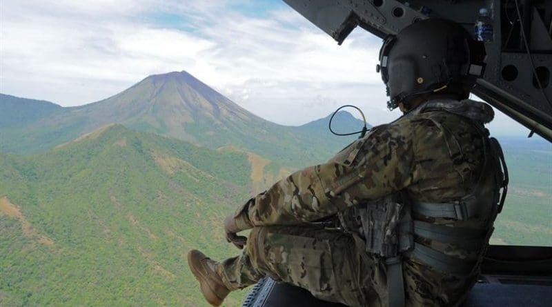 Army Sgt. King David, a CH-47 Chinook crew chief with the 1st Battalion, 228th Aviation Regiment, observes the San Cristobal volcano, one of at least six active volcanoes in Nicaragua, while transporting the Joint Task Force-Bravo U.S. Southern Command Situational Assessment Team, May 19, 2016. The JTF-Bravo S-SAT was invited to Nicaragua to demonstrate their ability to respond to a disaster situation. Air Force photo by Capt. David Liapis