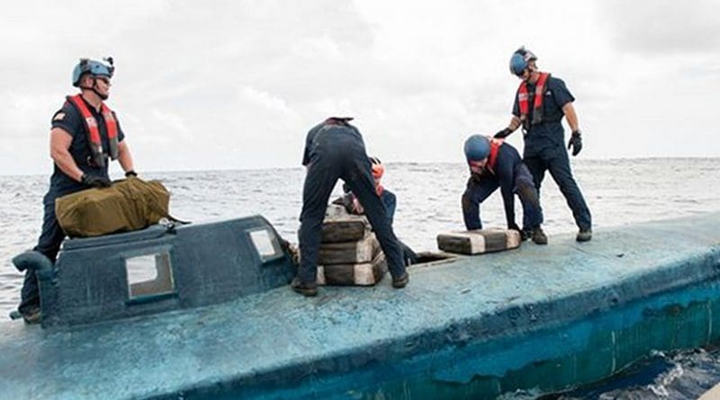 A US Coast Guard Cutter Stratton boarding team seizes cocaine bales from a self-propelled semi-submersible interdicted in international waters off the coast of Central America. The Coast Guard recovered more than 6 tons of cocaine from the 40-foot vessel. (Photo: MC2 LaNola Stone/Coast Guard)