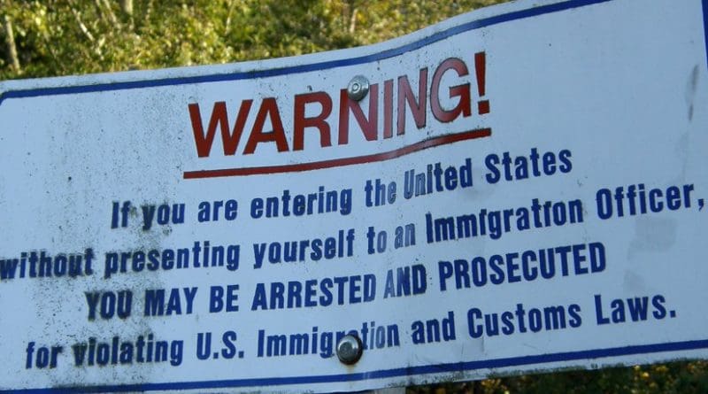 Sign on US border. Photo by Makaristos, Wikipedia Commons.