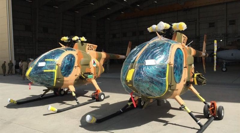 Two new MD-530 Cayuse Warrior helicopters, still with protective wrap on them, are seen at the 438th Air Expeditionary Wing/Train, Advise, Assist Command-Air in Kabul, Afghanistan, July 16, 2016. DoD photo by Lisa Ferdinando