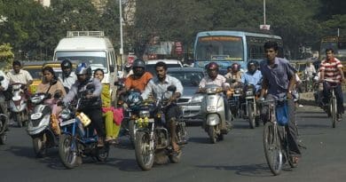 Bicycle and motorcycle riders in India.