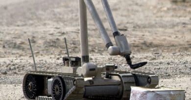 A U.S. Army explosive ordnance disposal (EOD) robot, “i-Robot”, pulls the wire of an alleged improvised explosive device (IED), found by the Iraqi Police. U.S. Navy photo by Journalist 1st Class Jeremy L. Wood, Wikipedia Commons.