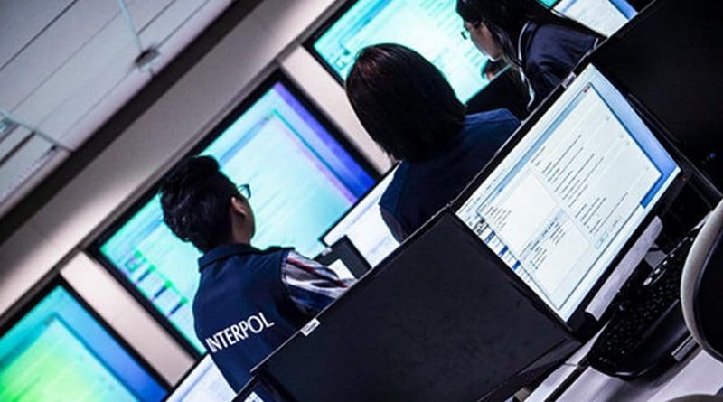 Interpol online fraud investigation team. Photo Credit: INTERPOL.