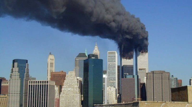 Plumes of smoke billow from the World Trade Center towers in Lower Manhattan, New York City, after a Boeing 767 hits each tower during the September 11 attacks. Photo by Flickr user Michael Foran, Wikipedia Commons.