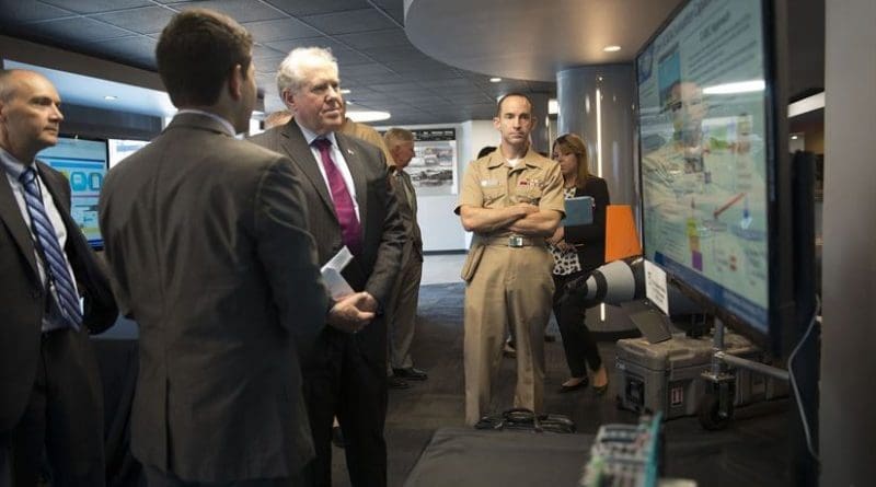 Frank Kendall, undersecretary of defense for acquisition, technology and logistics, announced Oct. 12, 2016, the continuation of an over-cost program supporting the global positioning system. Here, Kendall is briefed by Jose Romero-Mariona on cybersecurity science and technology during Kendall’s visit to Space and Naval Warfare Systems Center Pacific in San Diego. Aug. 24, 2016. Navy photo by Aaron Lebsack