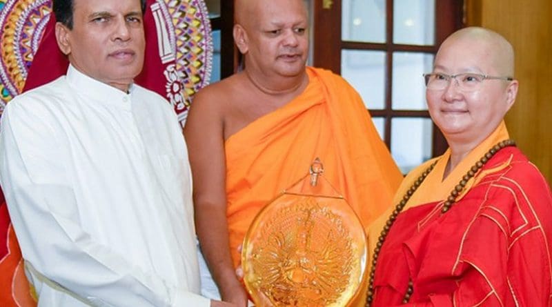 The President of the World Young Buddhist Sangha Sabha Ven. Shi Kuan female Buddhist Thero meets Sri Lanka's President Maithripala Sirisena. Photo Credit: Sri Lanka government.