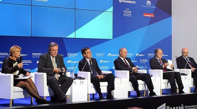 At a meeting of the Valdai International. Discussion Club. Left to right: Editor-in-Chief of RIA Novosti Svetlana Mironyuk, former German defence minister Volker Ruehe, former French prime minister Francois Fillon, Vladimir Putin, former Italian prime minister Romano Prodi, and President of the US Centre for the National Interest Dimitri Simes. Credit: Kremlin.ru