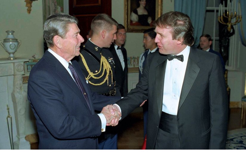 Donald Trump meet US President Ronald Reagon in 1987. Photo Ronald Reagan Presidential Library, White House photographer, Wikipedia Commons.