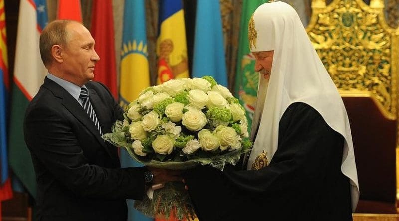 Russian President Vladimir Putin congratulates Patriarch of Moscow and All Russia Kirill on his 70th birthday and awarded him the order “For Services to the Fatherland,” 1st Class. Photo Credit: Kremlin.ru