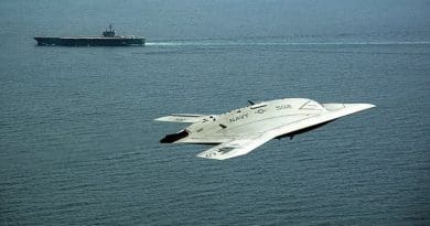 A drone, or Unmanned Combat Air System X-47B demonstrator flies near aircraft carrier USS George H.W. Bush, first aircraft carrier to successfully catapult launch unmanned aircraft from its flight deck, May 14, 2013 (U.S. Navy/Erik Hildebrandt)
