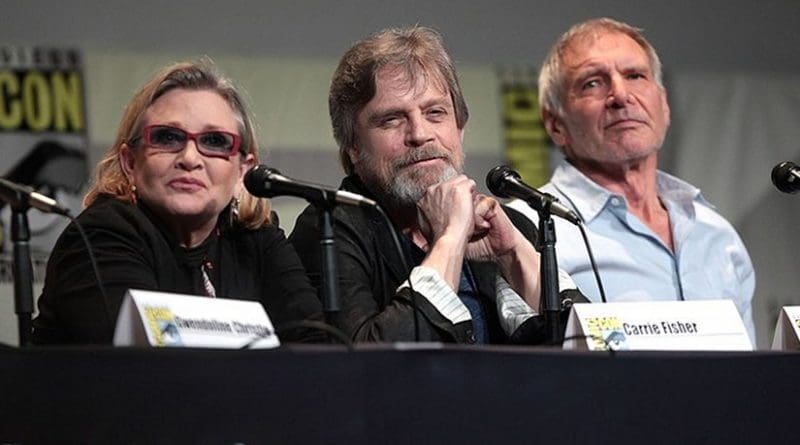 Carrie Fisher with fellow Star Wars actors Mark Hamill and Harrison Ford. Photo by Gage Skidmore, Wikipedia Commons.
