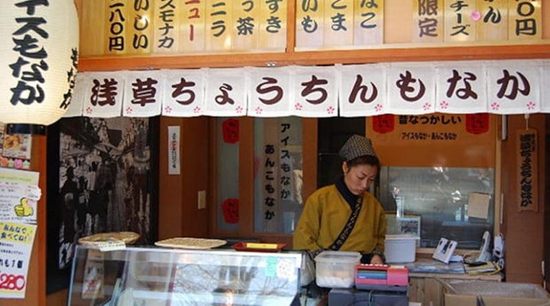 Woman working in Tokyo, Japan market.