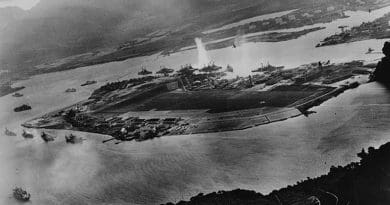 Photograph taken from a Japanese plane during the torpedo attack on ships moored on both sides of Ford Island shortly after the beginning of the Pearl Harbor attack. U.S. Navy photograph, Wikipedia Commons.