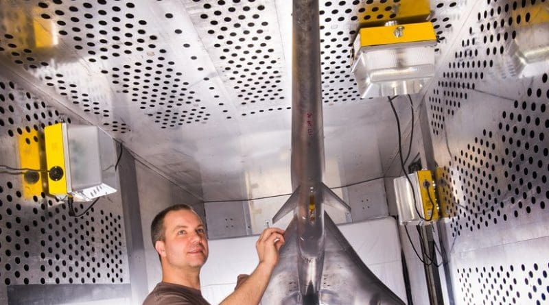 Mechanical technician Dan Pitts prepares a nine percent scale model of Lockheed Martin’s Quiet Supersonic Technology (QueSST) X-plane preliminary design for its first high-speed wind tunnel tests at NASA's Glenn Research Center in Cleveland. Credits: NASA