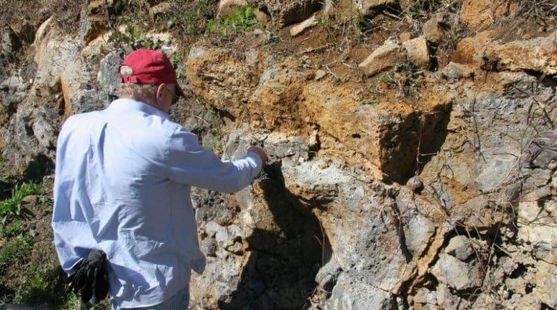 This is lead author Prof. Lewis D. Ashwal studying an outcropping of trachyte rocks in Mauritius. Such samples are about 6 million years old, but surprisingly contain zircon grains as old as 3000 million years. Credit Susan Webb/Wits University