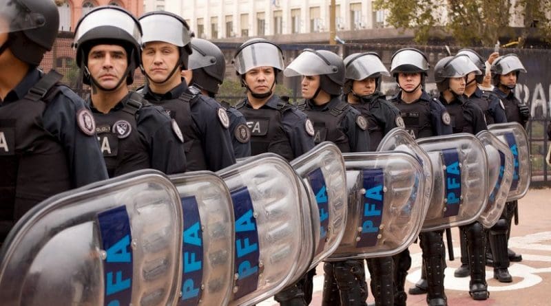 Riot Cops in line in Argentina. Photo by Beatrice Murch, Wikimedia Commons.