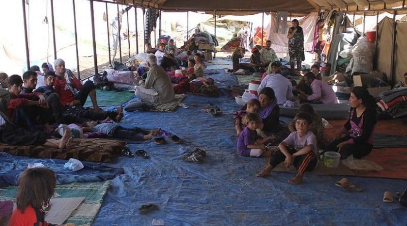 Yazidi refugees escaping from the Islamic State receiving support from the International Rescue Committee. Photo by Rachel Unkovic/International Rescue Committee, Wikimedia Commons.