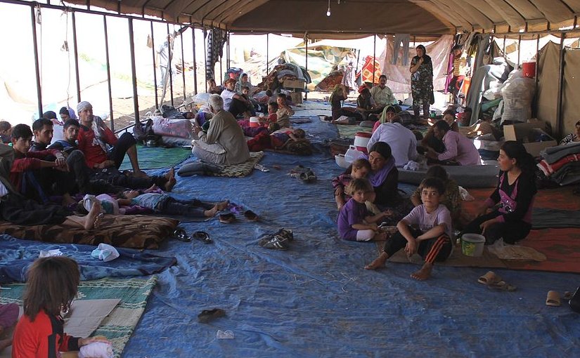 Yazidi refugees escaping from the Islamic State receiving support from the International Rescue Committee. Photo by Rachel Unkovic/International Rescue Committee, Wikimedia Commons.