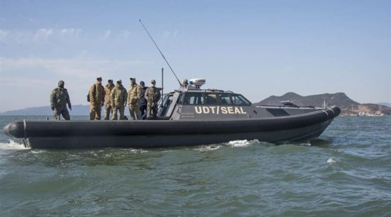 Explosive ordnance disposal technicians assigned to Explosive Ordnance Disposal Mobile Unit 5, Platoon 501, prepare for an EOD mine-countermeasure exercise with members of a South Korean navy underwater dive team off the coast of Jinhae, South Korea, as part of exercise Foal Eagle 2017, March 3, 2017. Foal Eagle is an annual, bilateral training exercise designed to enhance the readiness of U.S. and South Korean forces and their ability to work together during a crisis. Navy Combat Camera photo by Petty Officer 3rd Class Alfred A. Coffield