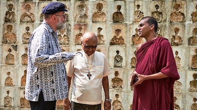 Anglican Father Michael Lapsley speaks to Catholic priest and a Buddhist monk in Colombo on Feb. 28. (ucanews.com photo)