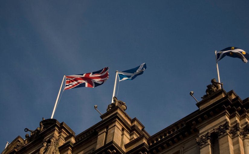 Flags of Scotland and United Kingdom flying in Edinburgh.