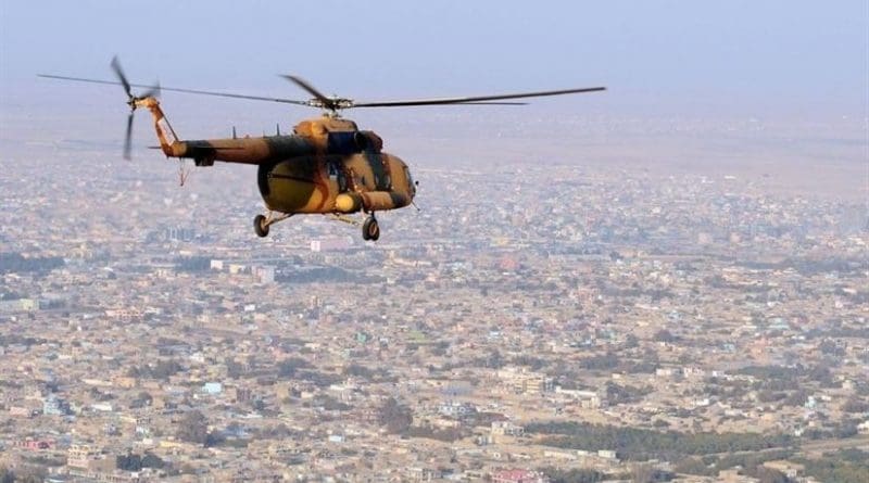 An Afghan National Army Mi-17 helicopter flies over the northern Afghan city of Mazar-e Sharif following a supply mission to an outpost at Qush Tappeh, Afghanistan, Nov. 13, 2010. Navy photo by Petty Officer 1st Class Eric S. Dehm