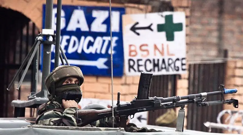 File photo of a soldier guarding the roadside checkpoint outside Srinagar International Airport in Jammu and Kashmir, India. Photo by Jrapczak, Wikipedia Commons.