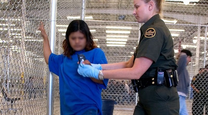 CBP Border Patrol agent conducts a pat down of a female Mexican being placed in a holding facility. Photo Credit: Gerald L. Nino, CBP, U.S. Dept. of Homeland Security