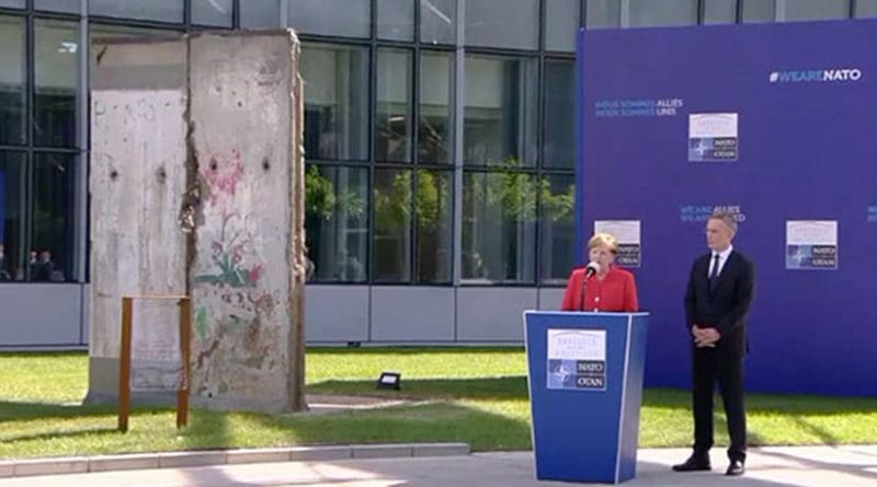 German Chancellor Angela Merkel with NATO Secretary General Jens Stoltenberg dedicating the Berlin Wall Memorial. Photo Credit: NATO