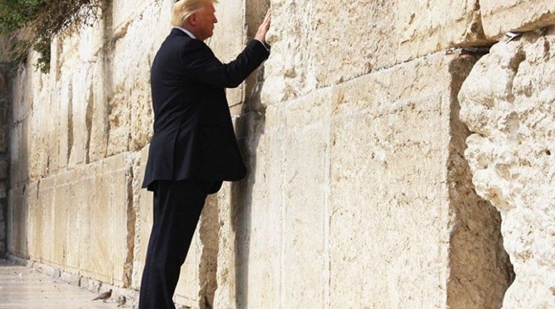 President Donald Trump places his hand on the Western Wall in Jerusalem, Monday, May 22, 2017, prior to placing a prayer in-between the stone blocks of the religious site. (Official White House Photo by Dan Hansen)