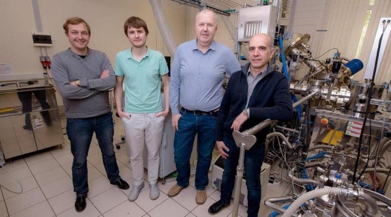 (From left) Dmitry Kuzmichev, Konstantin Egorov, Andrey Markeev, and Yury Lebedinskiy posing next to the atomic layer deposition apparatus at the Center of Shared Research Facilities, MIPT Credit MIPT's Press Office