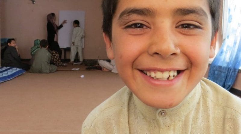 10-year-old Afghan Street Kid Mubasir smiles despite his difficulties.